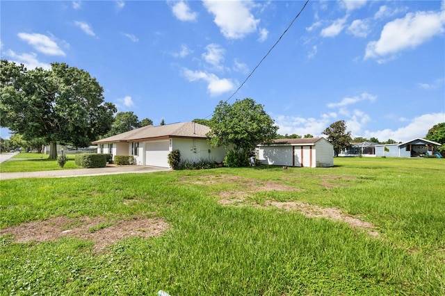 single story home with a storage shed and a front yard