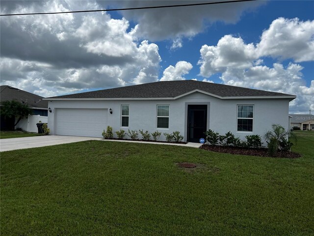 177 Cimarron Ln, Kissimmee, FL 34759 - ranch-style house featuring stucco siding, concrete driveway, a garage, and a front yard