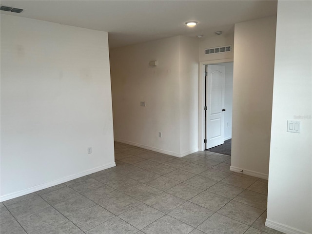 177 Cimarron Ln, Kissimmee, FL 34759 - spare room featuring light tile patterned floors and baseboards