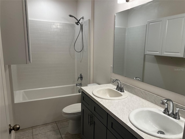 177 Cimarron Ln, Kissimmee, FL 34759 - full bathroom featuring toilet, double vanity, tile patterned floors, and shower / washtub combination