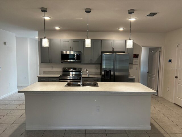 177 Cimarron Ln, Kissimmee, FL 34759 - kitchen with appliances with stainless steel finishes, a sink, light tile patterned flooring, and light countertops