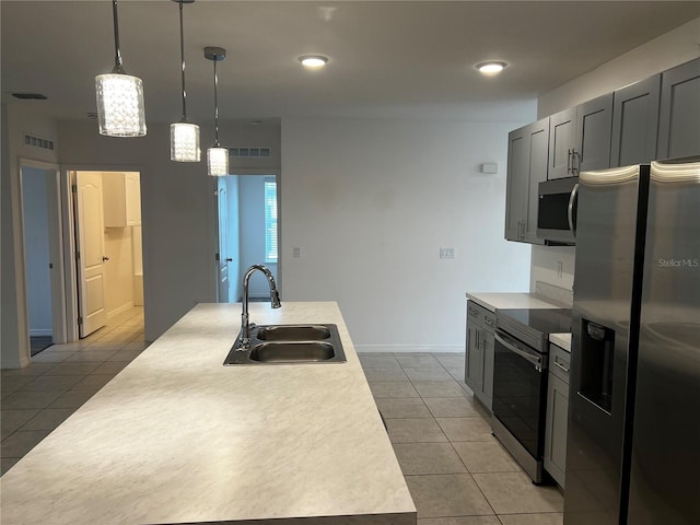 177 Cimarron Ln, Kissimmee, FL 34759 - kitchen featuring a sink, appliances with stainless steel finishes, light tile patterned flooring, light countertops, and recessed lighting