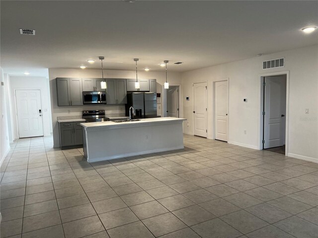 177 Cimarron Ln, Kissimmee, FL 34759 - kitchen with stainless steel microwave, electric range, refrigerator with ice dispenser, a sink, and gray cabinetry
