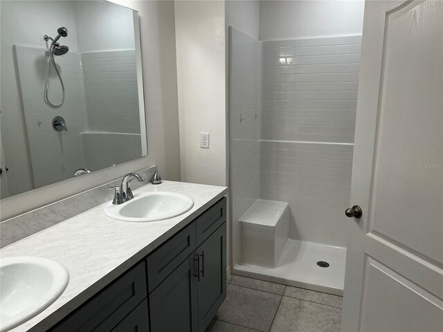 177 Cimarron Ln, Kissimmee, FL 34759 - full bathroom with double vanity, tiled shower, and tile patterned floors