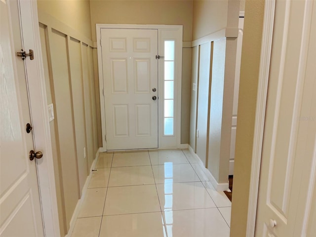 entrance foyer with light tile patterned floors