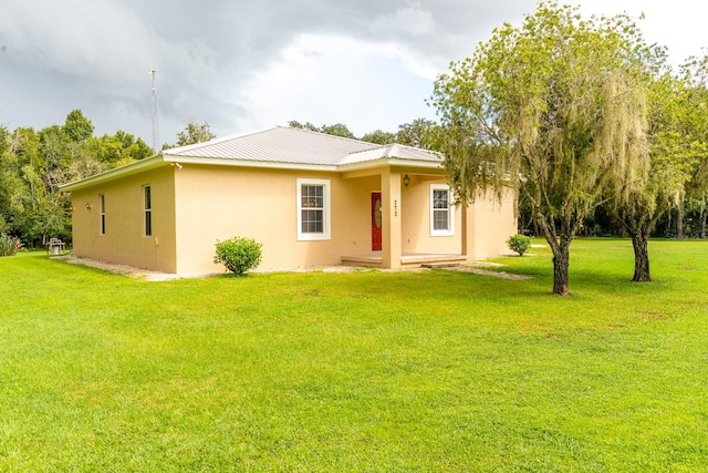 back of house with a yard