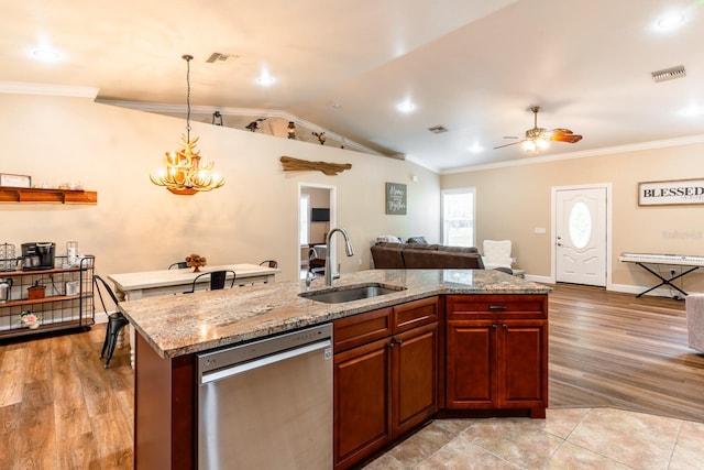 kitchen featuring ceiling fan with notable chandelier, dishwasher, pendant lighting, sink, and light wood-type flooring