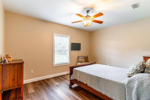 bedroom with dark wood-type flooring and ceiling fan