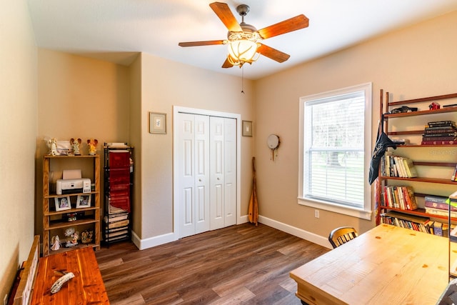 office featuring dark wood-type flooring and ceiling fan