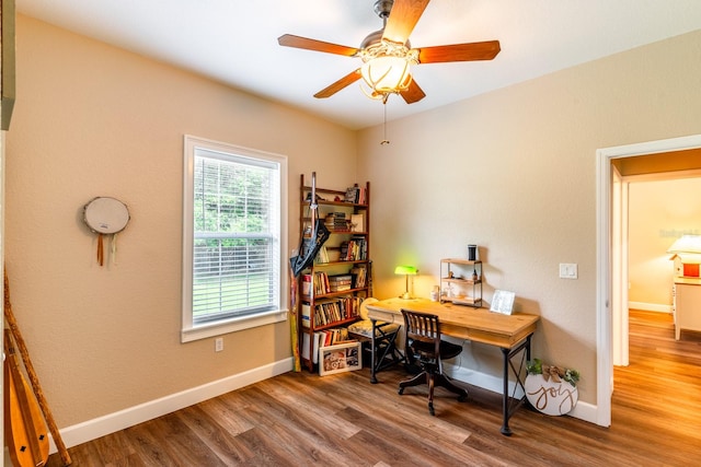 home office featuring hardwood / wood-style floors and ceiling fan