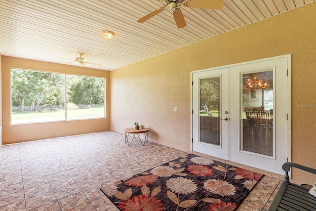 sunroom with french doors and ceiling fan