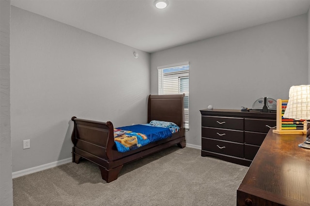 bedroom with light colored carpet