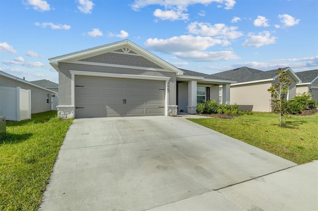 single story home featuring a garage and a front yard