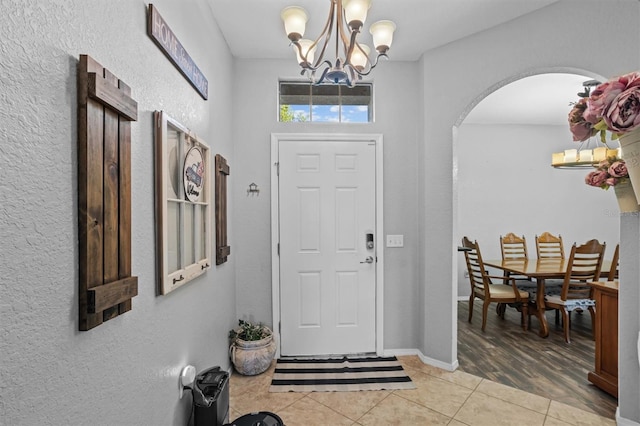 entrance foyer with a chandelier and hardwood / wood-style flooring