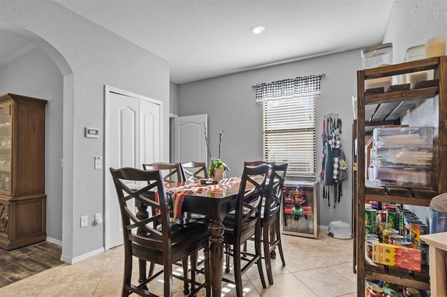 dining space with light tile patterned floors