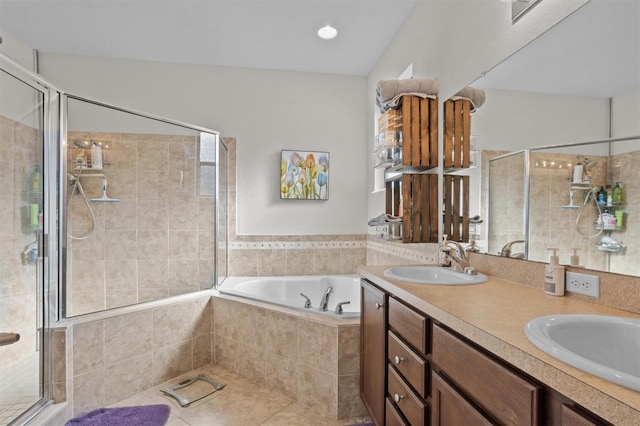 bathroom with tile patterned flooring, vanity, and independent shower and bath