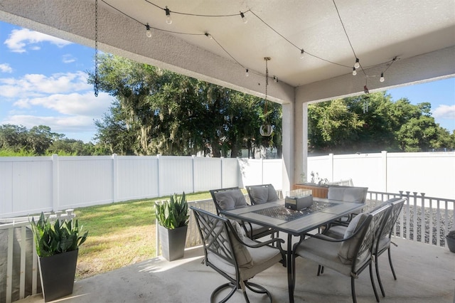 2158 Mirasol Dr, Winter Haven, FL 33881 - fenced backyard with outdoor dining space and a patio