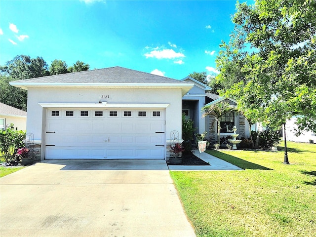2158 Mirasol Dr, Winter Haven, FL 33881 - ranch-style house with stucco siding, stone siding, and driveway