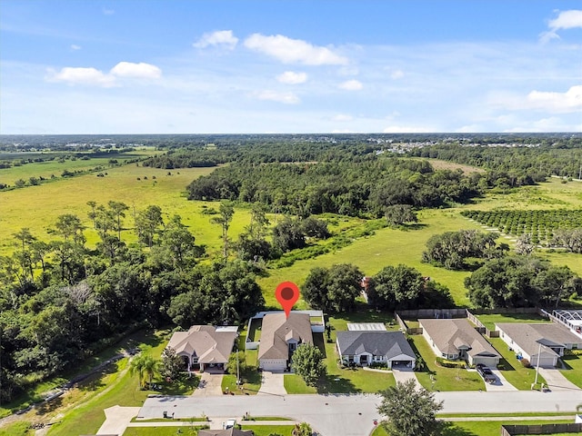 2158 Mirasol Dr, Winter Haven, FL 33881 - aerial perspective of suburban area with a heavily wooded area