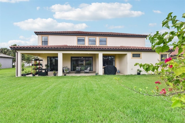 back of house with an outdoor hangout area, a patio area, and a lawn