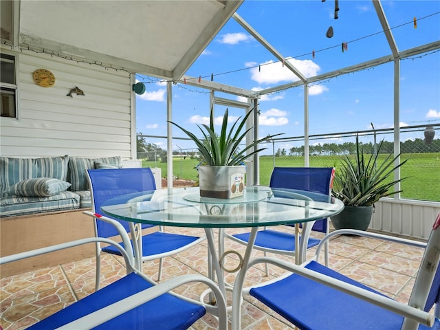 view of patio with glass enclosure