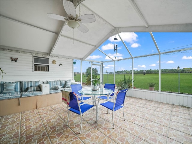 view of patio / terrace featuring glass enclosure and ceiling fan