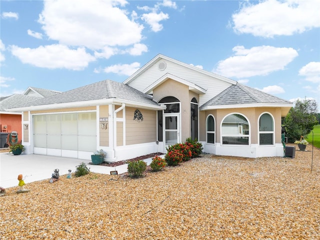 ranch-style house featuring a garage