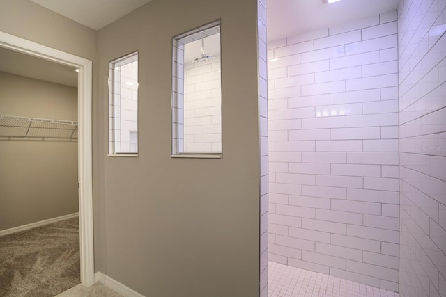 interior space featuring tiled shower