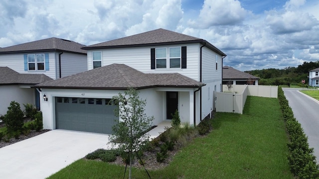 view of front of property with a garage and a front yard