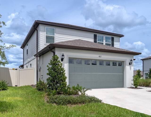 view of front of property with a garage