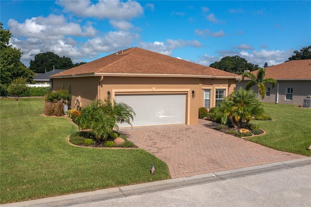 single story home featuring a front lawn and a garage