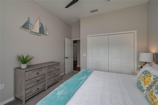 carpeted bedroom featuring a closet and ceiling fan