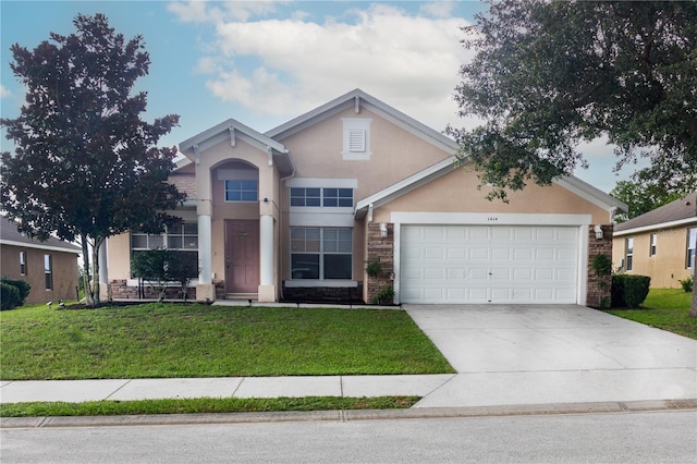 view of front of home with a garage and a front yard