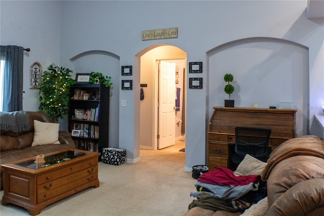 carpeted living room with a fireplace