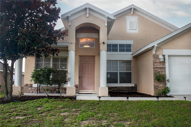 exterior space with a garage and a front lawn