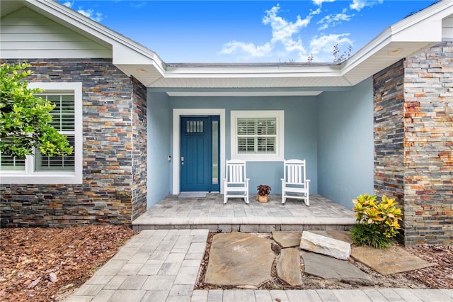 doorway to property with a porch