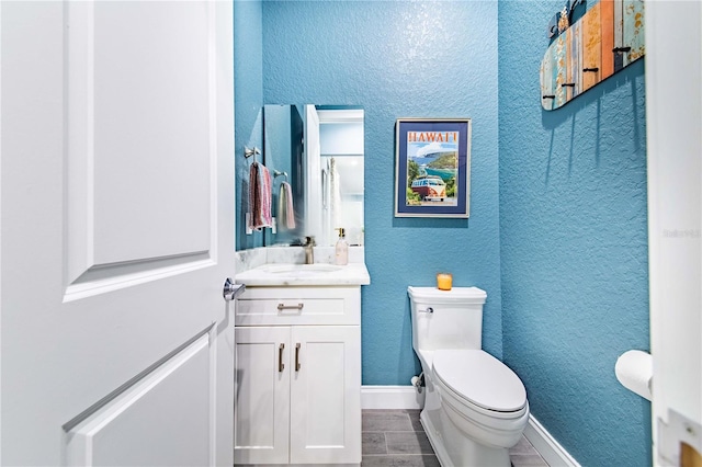 bathroom featuring vanity, toilet, and tile patterned floors