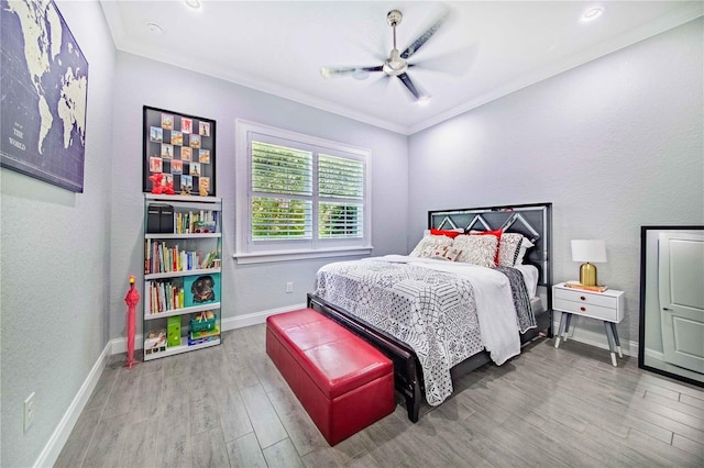 bedroom featuring ceiling fan, ornamental molding, and light wood-type flooring