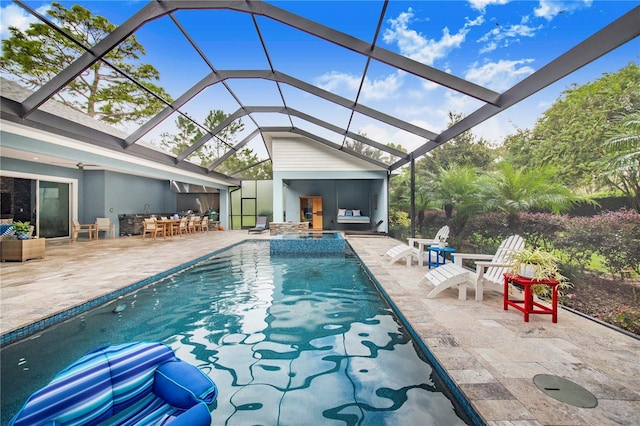 view of swimming pool featuring a patio area and glass enclosure