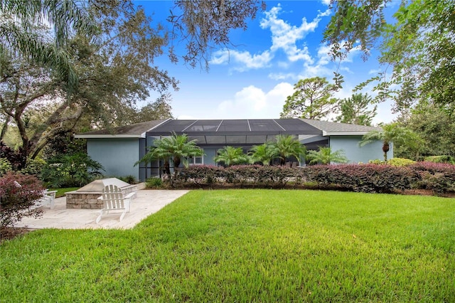 exterior space featuring a lanai, a fire pit, and a patio