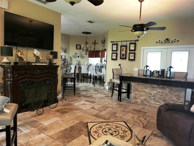 living room featuring ceiling fan and french doors