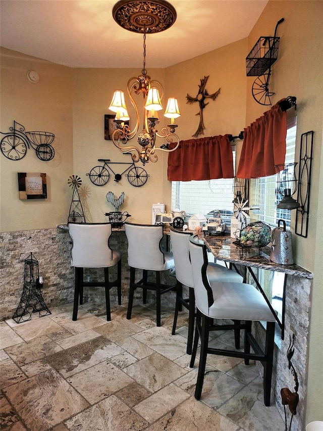 dining room featuring plenty of natural light and a chandelier