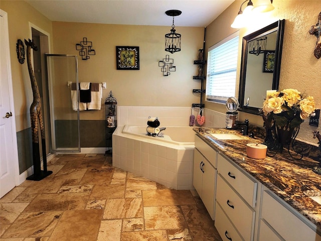 bathroom featuring vanity and separate shower and tub