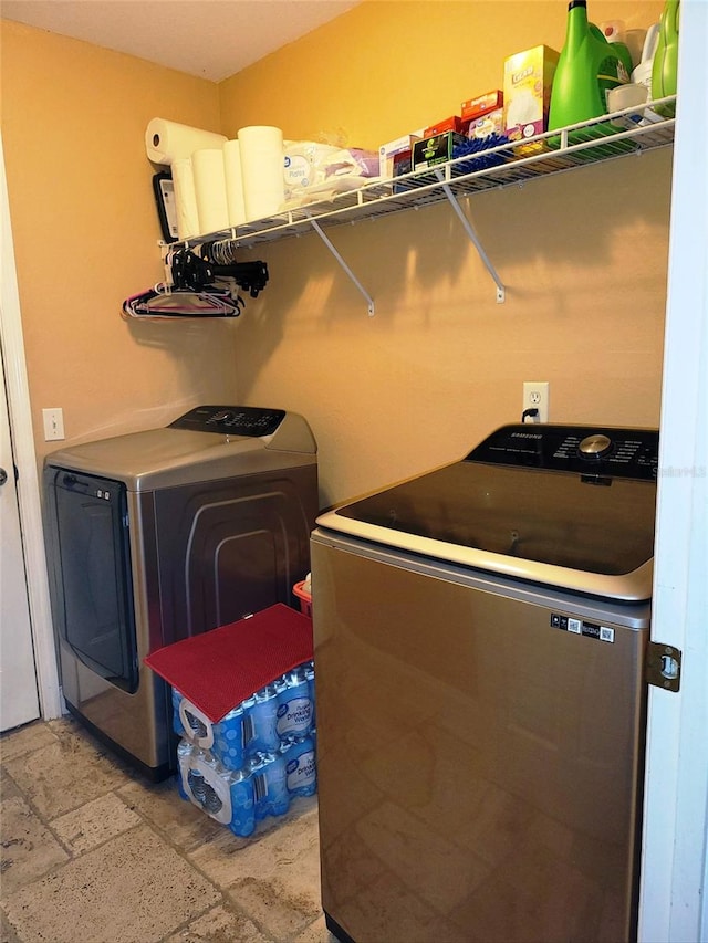 washroom with separate washer and dryer