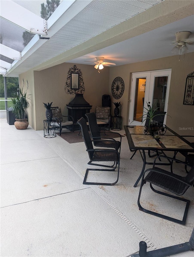 view of patio featuring french doors and ceiling fan