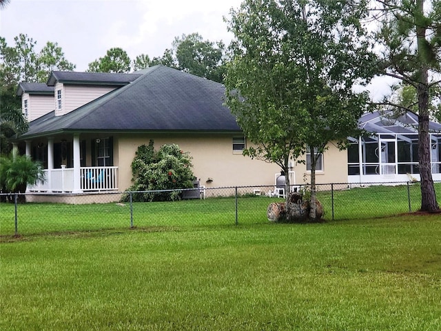 rear view of property with a yard