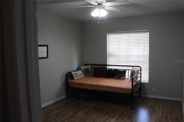 bedroom featuring dark wood-type flooring and ceiling fan