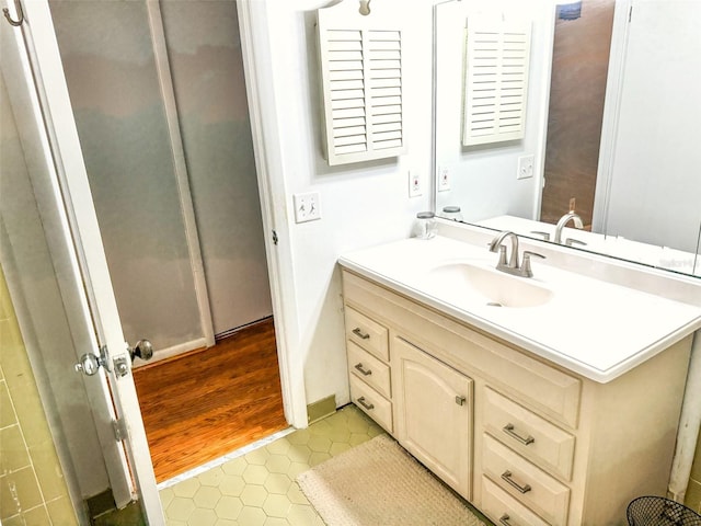 bathroom with vanity and tile patterned flooring