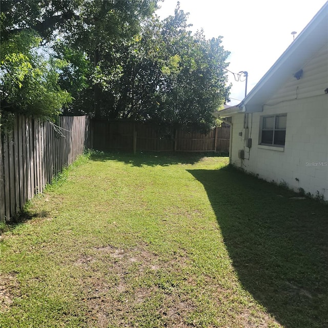 view of yard with a fenced backyard