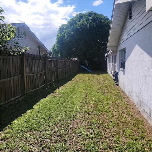 view of yard featuring cooling unit and a fenced backyard